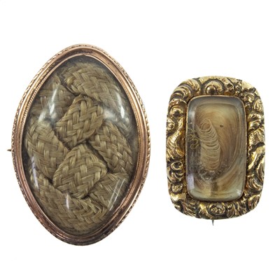 Lot 122 - Two 19th century gold mourning brooches.