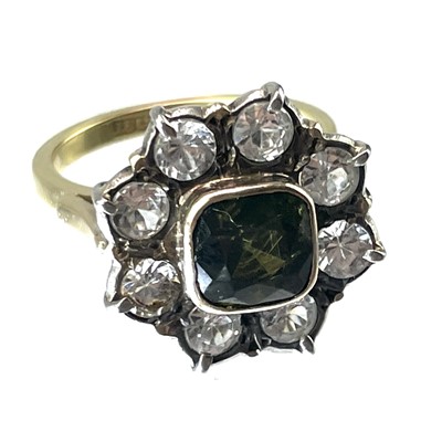 Lot 183 - An 18ct white sapphire and green garnet set ring