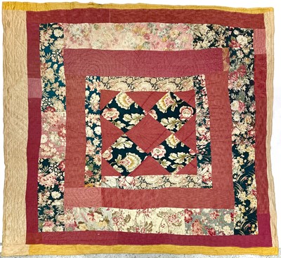 Lot 1607 - An early 20th century Durham patchwork quilt...