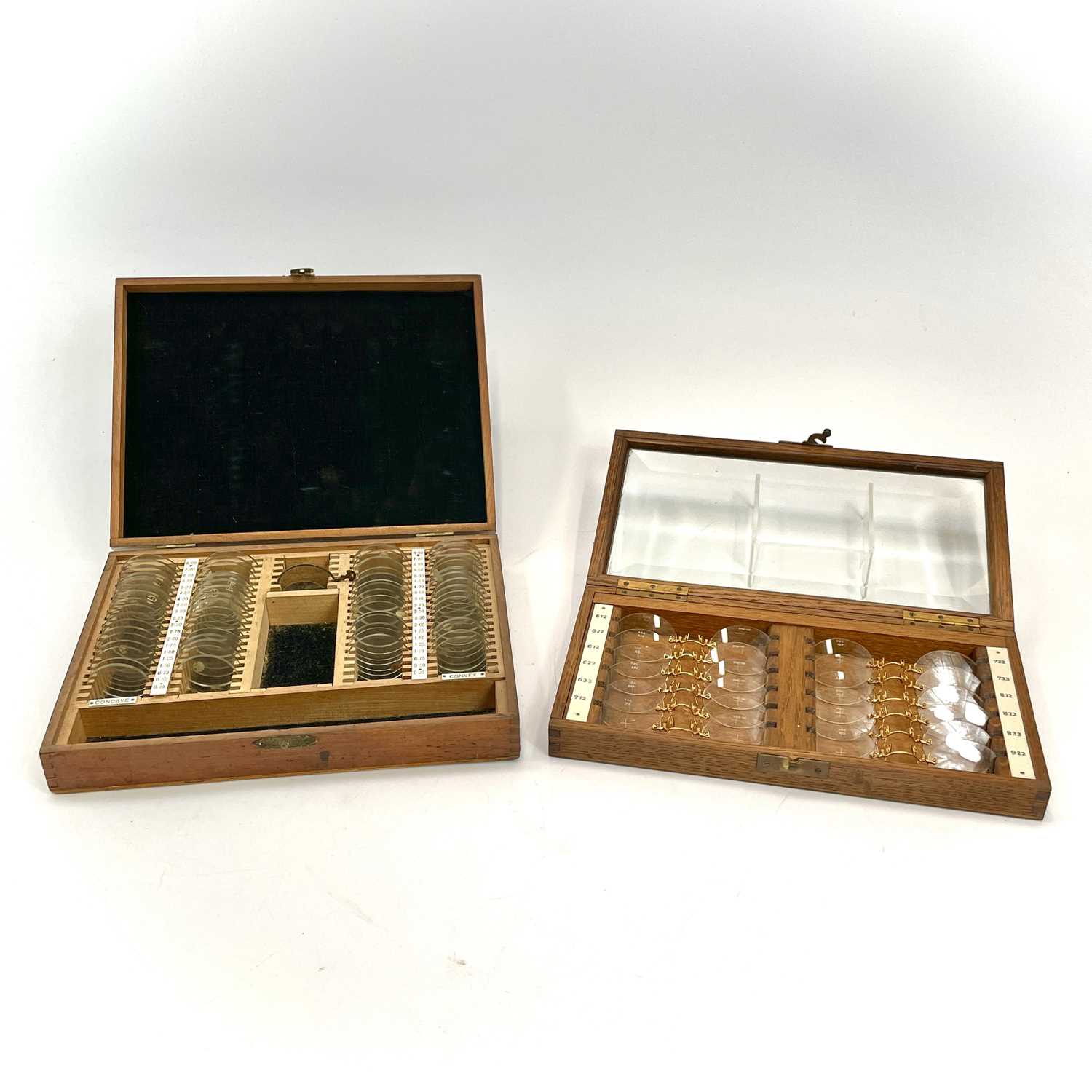 Lot 199 - A set of twelve Opticians lenses, with gilt...