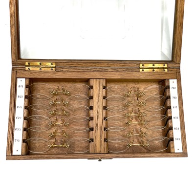 Lot 199 - A set of twelve Opticians lenses, with gilt...