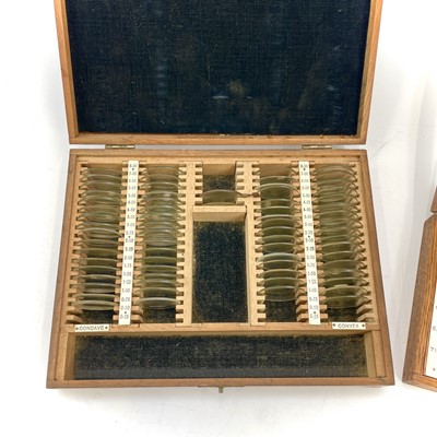 Lot 199 - A set of twelve Opticians lenses, with gilt...