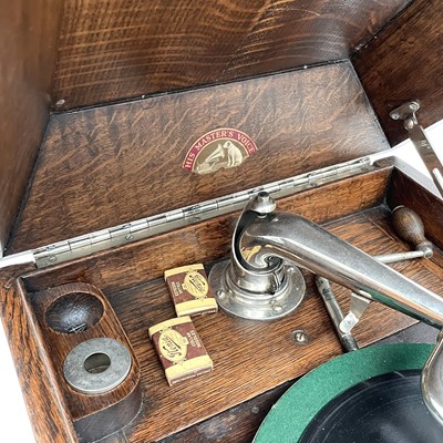 Lot 50 - An HMV oak table top wind-up gramophone,...