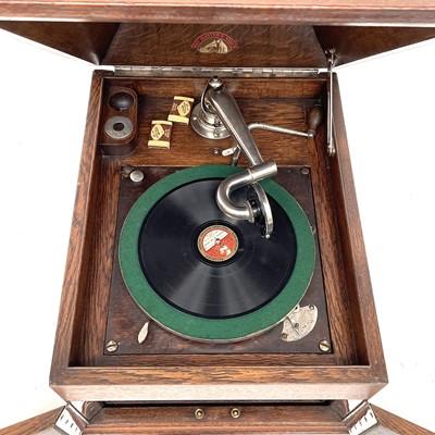 Lot 50 - An HMV oak table top wind-up gramophone,...
