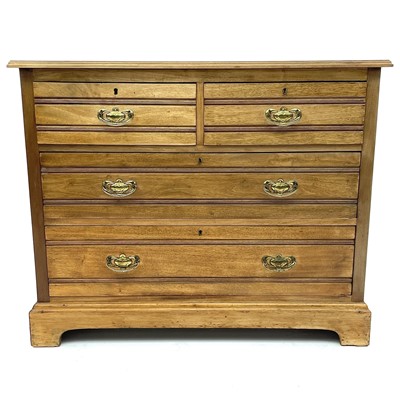 Lot 1856 - An Edwardian walnut chest of two short and two...