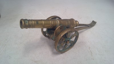 Lot 9 - A Brass Cannon. The piece measures 23cm long...
