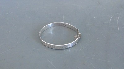 Lot 66 - A sterling silver bangle marked Birmingham...