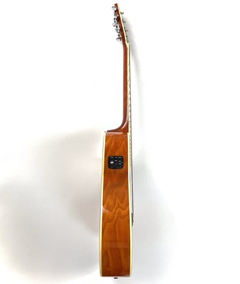 Lot 81 - A 'Washburn' EA18TS electro acoustic guitar.