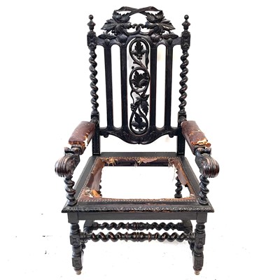 Lot 107 - A Victorian carved stained oak open armchair.
