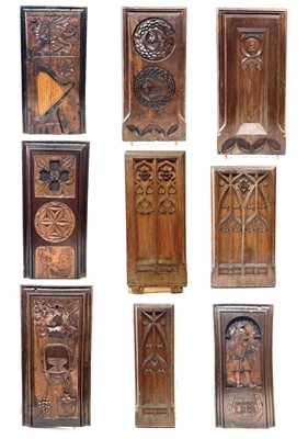 Lot 113 - Nine Victorian carved oak pew ends.