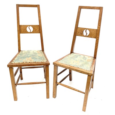 Lot 404 - A pair of Arts and Crafts oak side chairs.