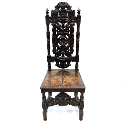 Lot 119 - A carved oak high back hall chair,19th century.