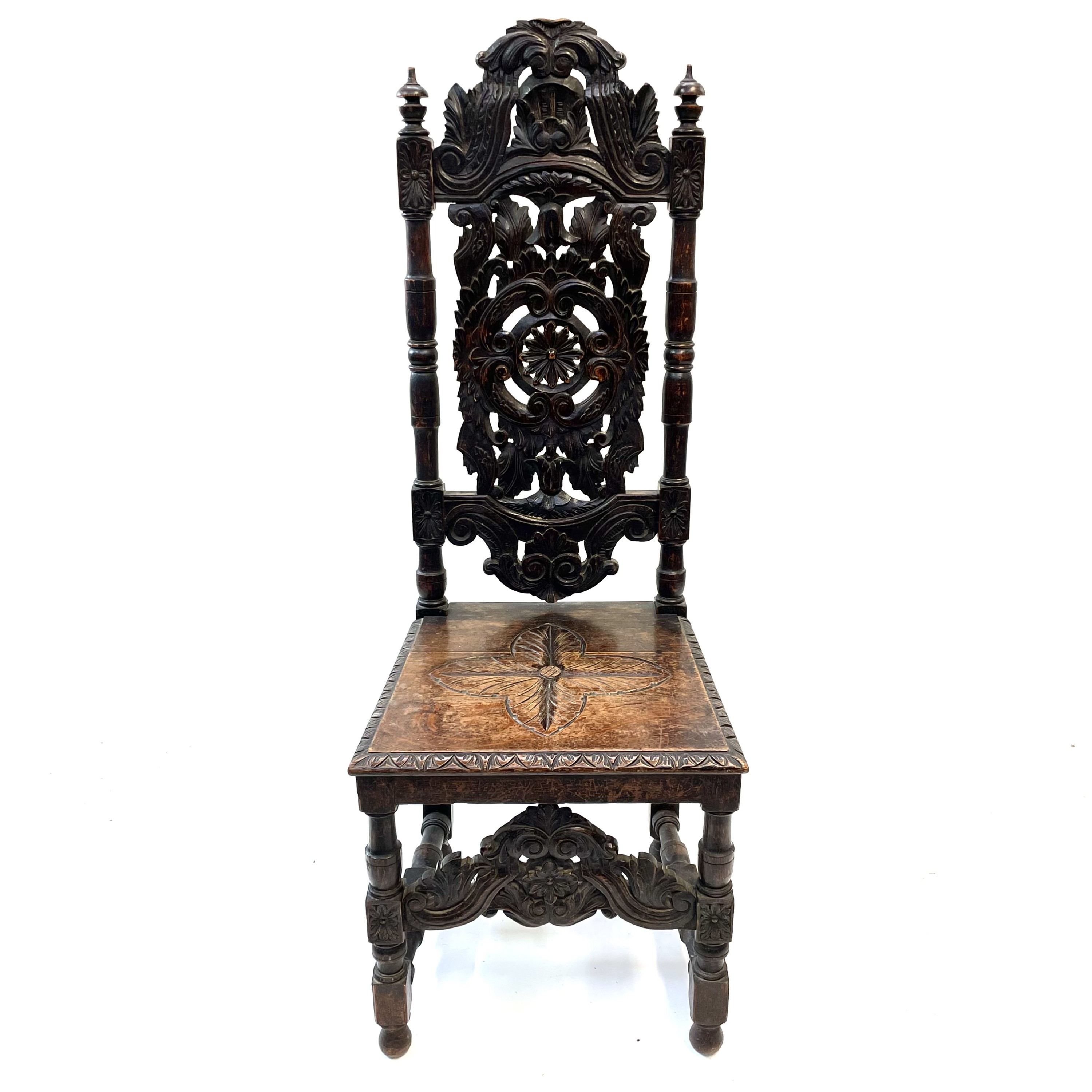 Lot 119 - A carved oak high back hall chair,19th