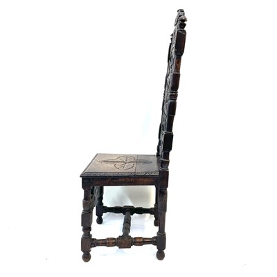 Lot 119 - A carved oak high back hall chair,19th century.