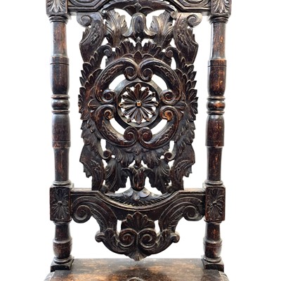 Lot 119 - A carved oak high back hall chair,19th century.