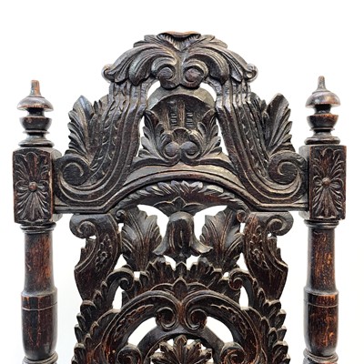 Lot 119 - A carved oak high back hall chair,19th century.