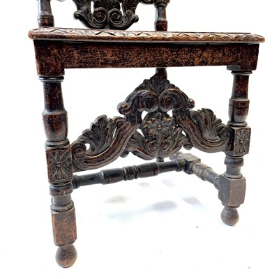 Lot 119 - A carved oak high back hall chair,19th century.