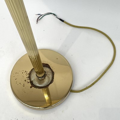 Lot 1839 - A modern gilt metal standard uplighter, with...