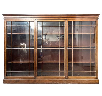 Lot 1834 - An Edwardian walnut bookcase, with triple...