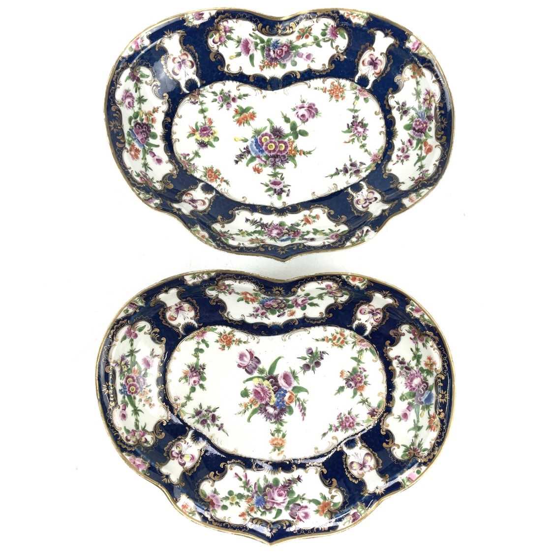 Lot 825 - A pair of Worcester blue scale porcelain