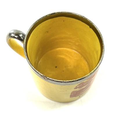 Lot 127 - An early Victorian canary yellow nursery mug.