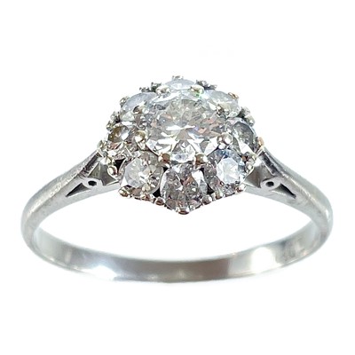 Lot 36 - An early 20th century 18ct white gold diamond cluster ring.