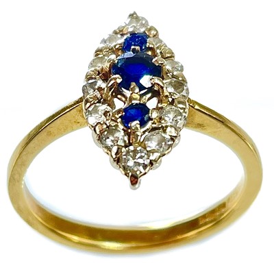 Lot 299 - An 18ct sapphire and diamond navette cluster ring.