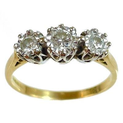 Lot 45 - An 18ct diamond set three stone ring.