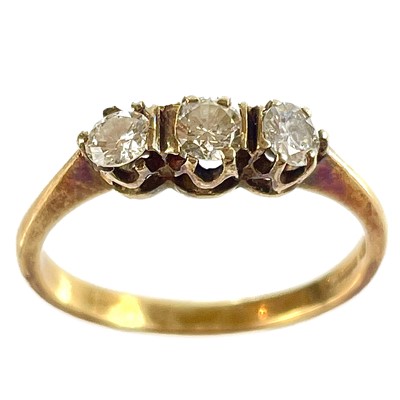 Lot 324 - An 18ct diamond three stone ring.