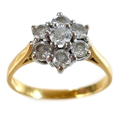 Lot 313 - An 18ct gold diamond set cluster ring.