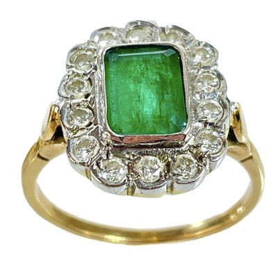 Lot 70 - An attractive 18ct gold emerald and diamond cluster ring.