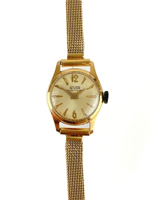 Lot 514 - An 18ct gold ladies manual wind bracelet wristwatch.