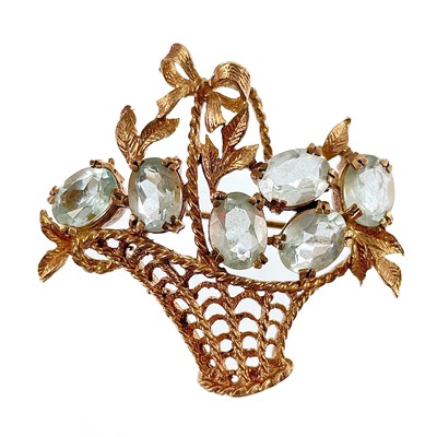 Lot 134 - A 1960's 9ct rose gold and aquamarine set basket brooch.