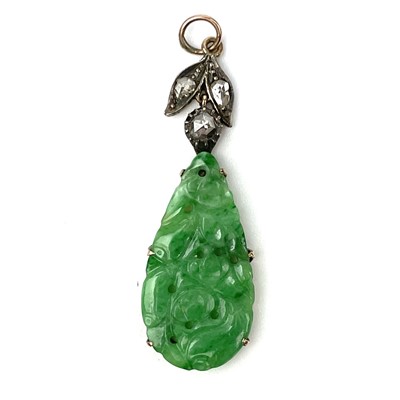 Lot 353 - A Chinese green jade and diamond set pendant.