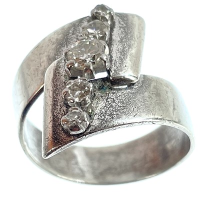 Lot 142 - A modern 9ct white gold diamond set five stone ring.