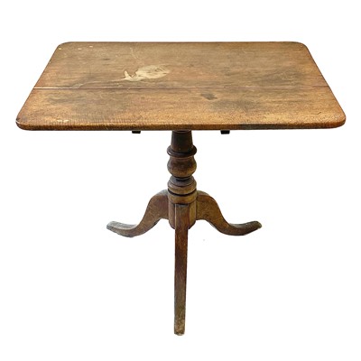 Lot 140 - A George III oak tripod table.