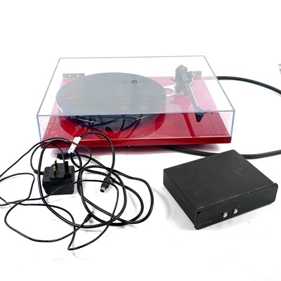 Lot 13 - A stylish red Rega RP6 turntable.