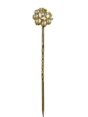 Lot 96 - A high purity gold diamond and pearl set crescent and star stick pin.