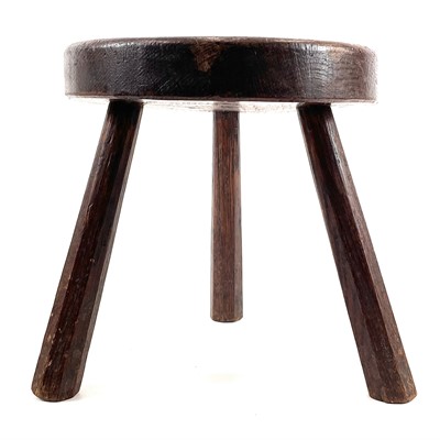 Lot 216 - An oak milking stool.