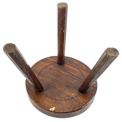 Lot 216 - An oak milking stool.