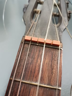 Lot 9 - An early 20th century parlor guitar.