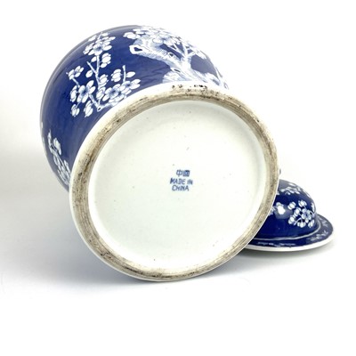 Lot 135 - A Chinese porcelain blue and white prunus pattern baluster vase and cover, 20th century