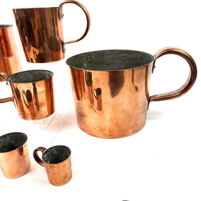 Lot 154 - A set of Royal Navy copper rum or grog measures.