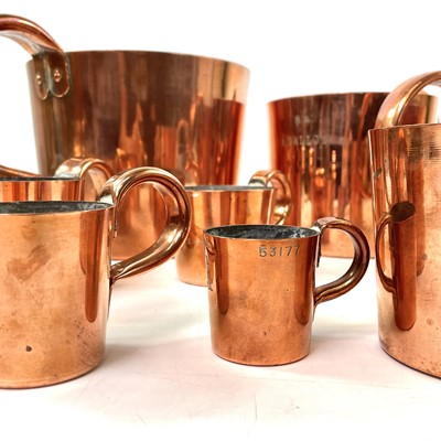 Lot 154 - A set of Royal Navy copper rum or grog measures.