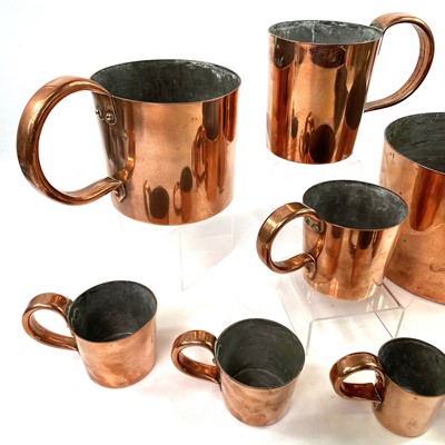 Lot 154 - A set of Royal Navy copper rum or grog measures.