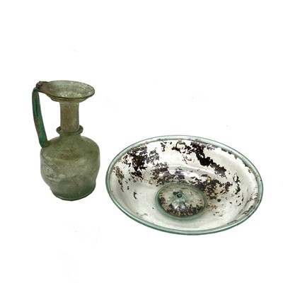 Lot 878 - A Roman 2nd-4th century CE pale green glass...