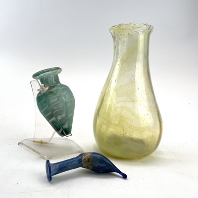 Lot 905 - An after antique light blue glass amphoriskos...