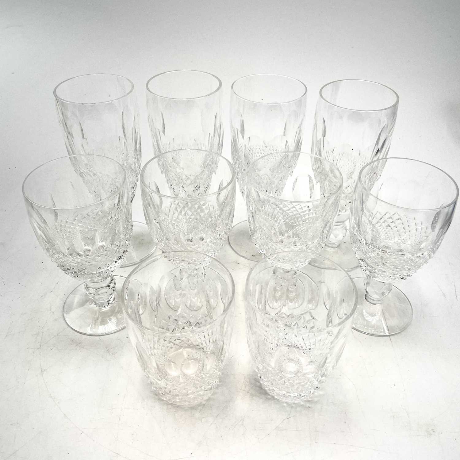 Lot 933 - A set of four Waterford crystal champagne...