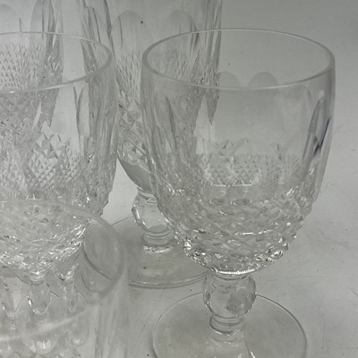 Lot 933 - A set of four Waterford crystal champagne...