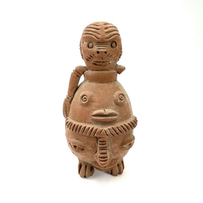 Lot 305 - Pre-Columbian style soapstone carving of a seated figure with chip carved decoration.